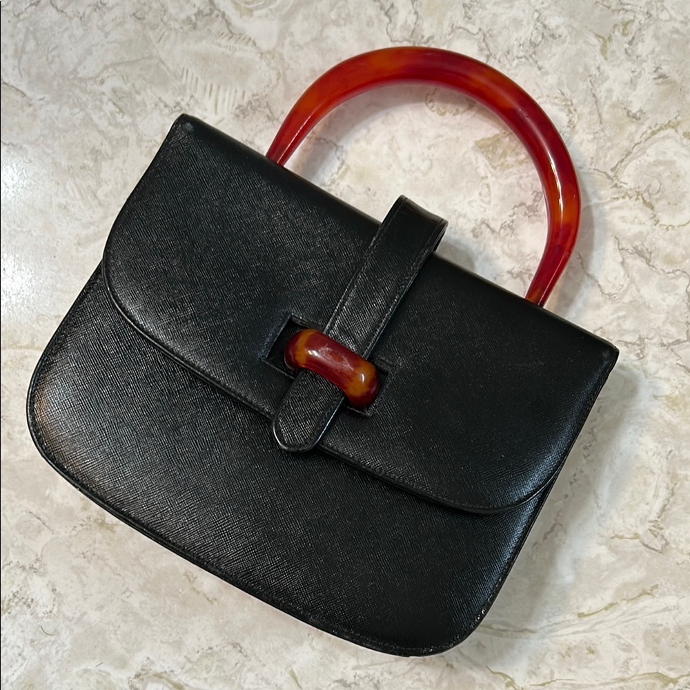 Elegant Black Handbag with Red Accents